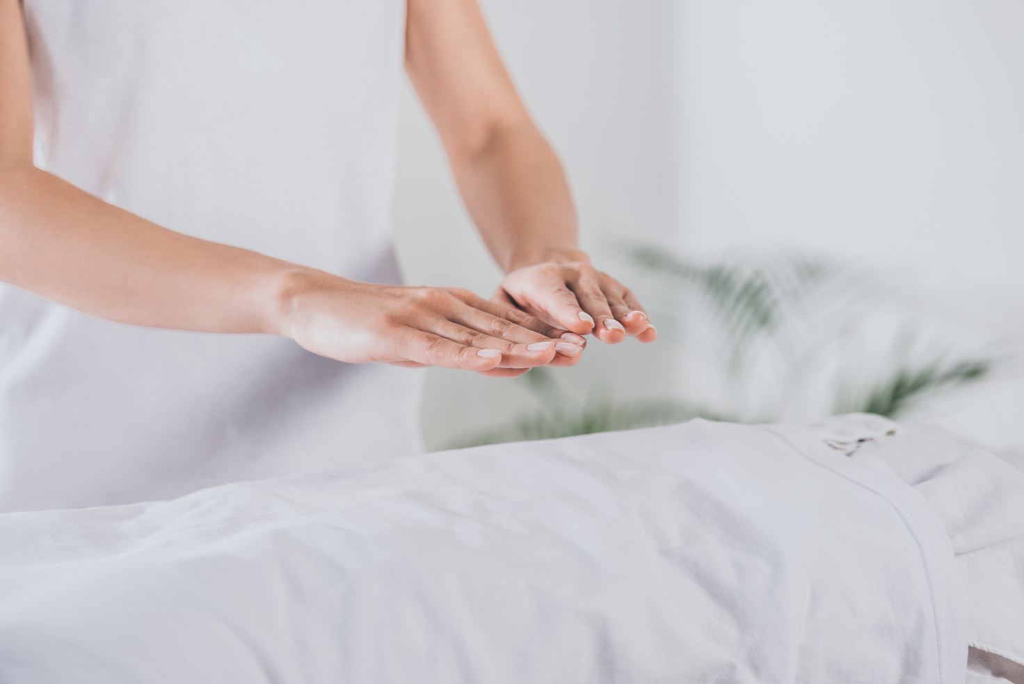 partial view of reiki therapist practising palm healing session